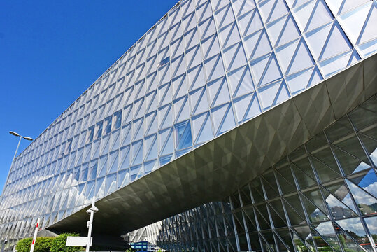 Geneva, Switzerland, Europe :  05.2026 :  Japan International Tobacco (JIT) - futuristic headquarters building with characteristic innovative self-shading glass facade