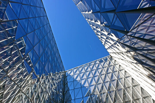 Geneva, Switzerland, Europe :  05.2026 :  Japan International Tobacco (JIT) - futuristic headquarters building with characteristic innovative self-shading glass facade