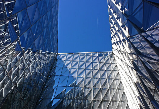 Geneva, Switzerland, Europe :  05.2026 :  Japan International Tobacco (JIT) - futuristic headquarters building with characteristic innovative self-shading glass facade