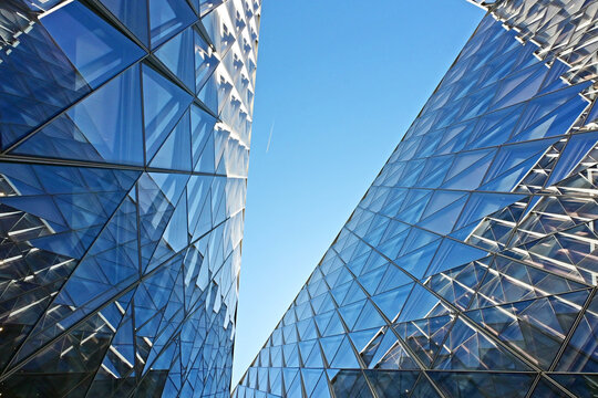 Geneva, Switzerland, Europe :  05.2026 :  Japan International Tobacco (JIT) - futuristic headquarters building with characteristic innovative self-shading glass facade