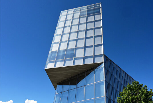 Geneva, Switzerland, Europe :  05.08.2026 :  Japan International Tobacco (JIT) - futuristic headquarters building with characteristic innovative self-shading glass facade