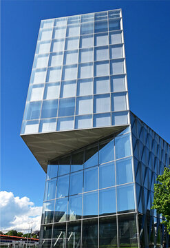 Geneva, Switzerland, Europe :  05.2026 :  Japan International Tobacco (JIT) - futuristic headquarters building with characteristic innovative self-shading glass facade