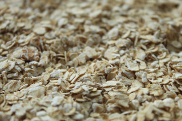 Obraz premium Oatmeal flakes macro texture top view