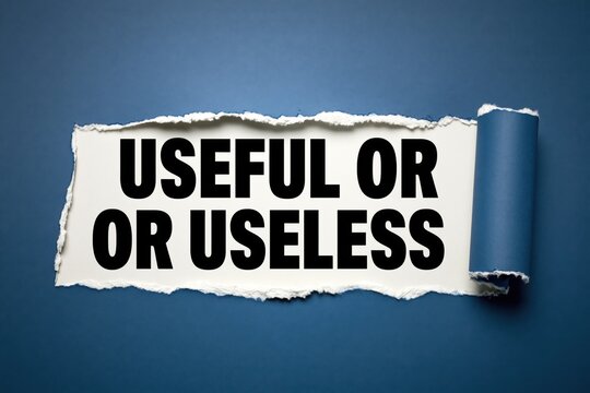 Concept text useful or useless revealed through a dark blue torn paper hole