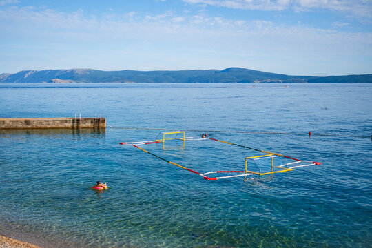 Floating water polo field in crystal clear Adriatic Sea on a sunny summer day