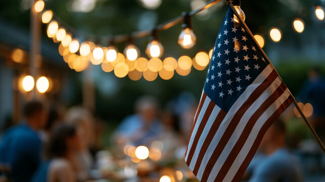 Family and friends celebrating Independence Day with a backyard BBQ gathering in a festive evening glow, community spirit and American flag display concept, faceless, faces not