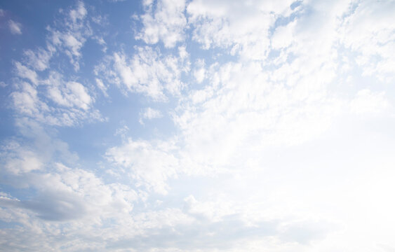 Bright Blue Sky with Soft White Clouds on a Sunny Summer Day
