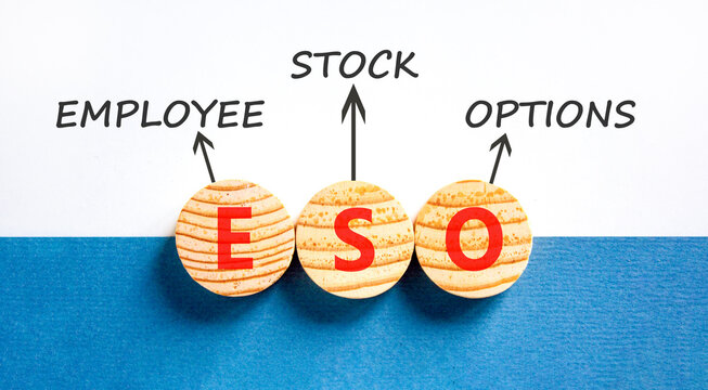 ESO employee stock options symbol. Concept words ESO employee stock options on beautiful wooden circles. Beautiful white blue background. Business ESO employee stock options concept. Copy space.