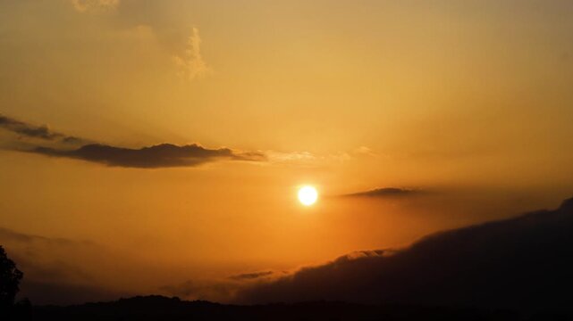 Scenery of a setting sun in a red sky, clouds, and sunset, background for year-end parties.
