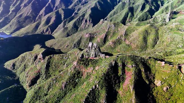 Aerial view circling jagged volcanic rock formation, Pico del Ingles, Anaga, Tenerife