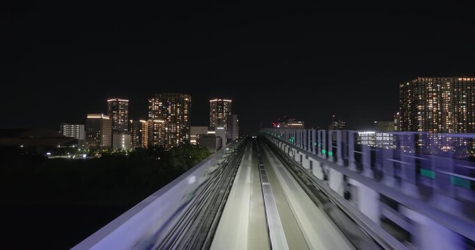 Train goes through city at night,  concept of speed
