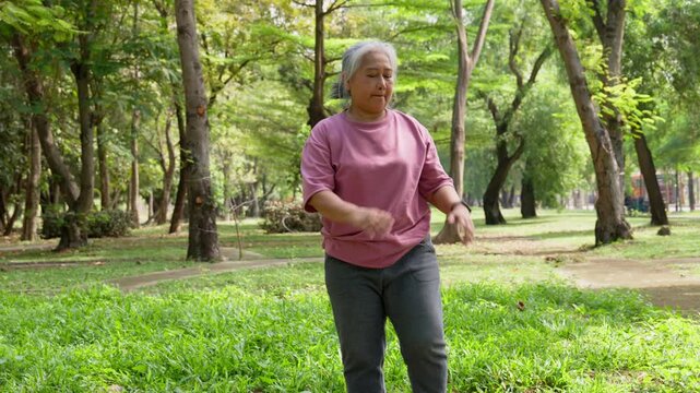 Park Wellness: Capturing the image of a spirited senior woman exercising in a vibrant park setting, embodying a healthy and active lifestyle.