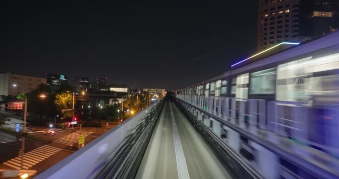 Train goes through city at night,  concept of speed
