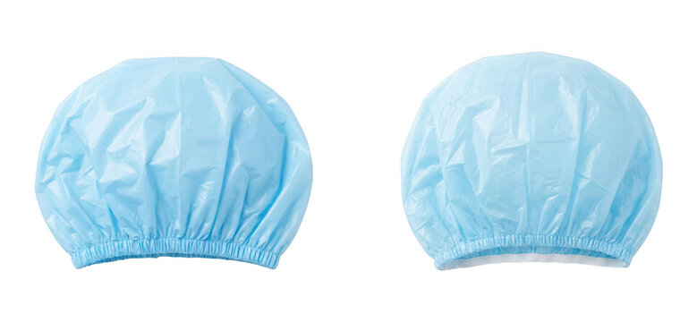 Two blue disposable shower caps isolated on transparent background