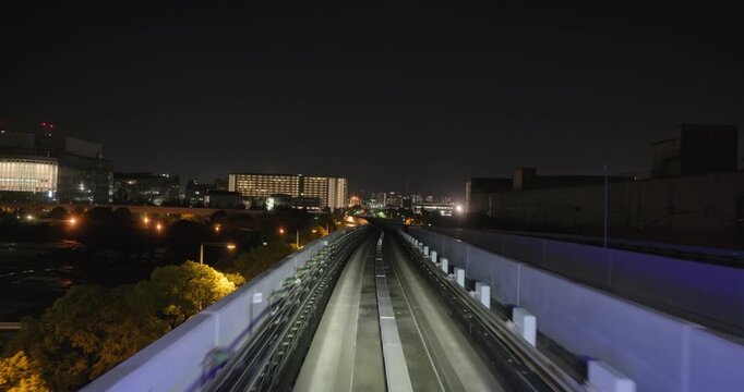 Train goes through city at night,  concept of speed