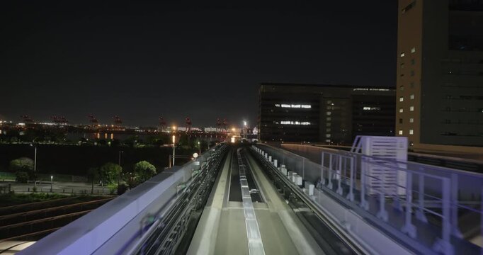 Train goes through city at night,  concept of speed