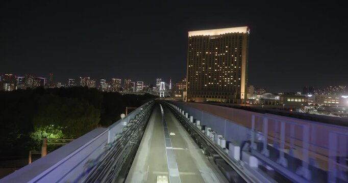 Train goes through city at night,  concept of speed