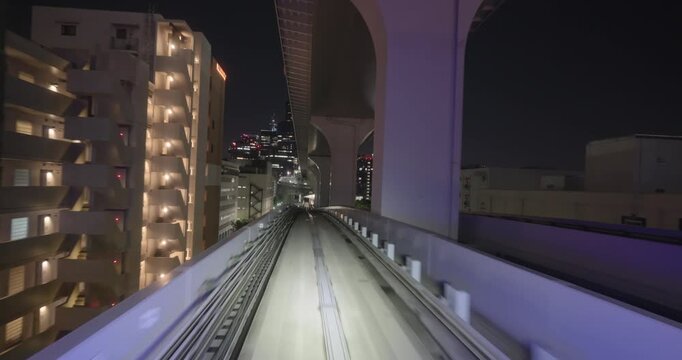 Train goes through city at night,  concept of speed