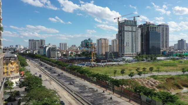 Aerial drone footage of Starlake Tay Ho Tay urban area and Ngoai Giao Doan (Diplomatic Corps Area) in Hanoi, Vietnam. Stunning bird's-eye view of modern residential towers, luxury apartments