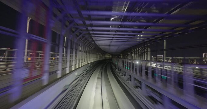 Train goes through city at night,  concept of speed