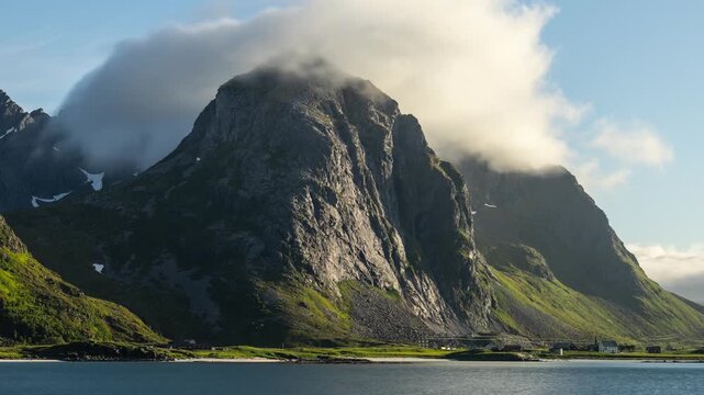 Time lapse of the fog covering the top of a mountain along the coast of Norway