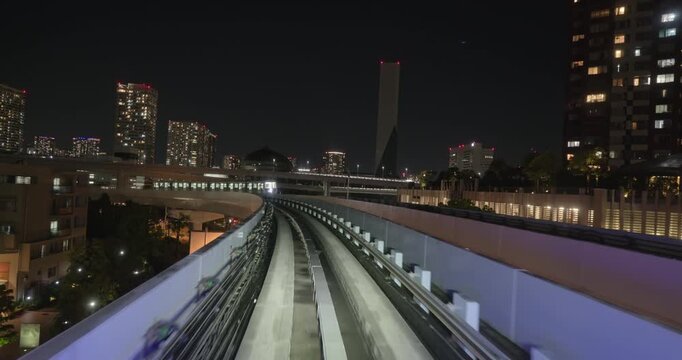 Train goes through city at night,  concept of speed