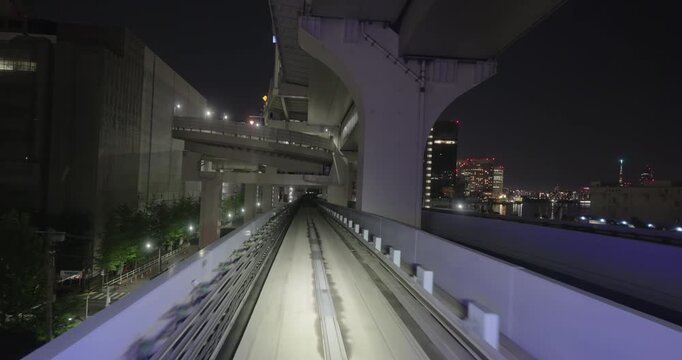 Train goes through city at night,  concept of speed