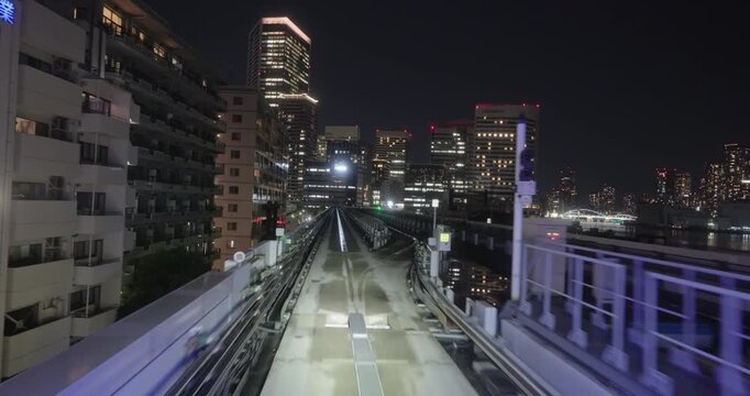 Train goes through city at night,  concept of speed
