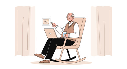 Fototapeta premium Elderly Man Using Laptop and Pointing at Picture While Relaxing in Rocking Chair at Home