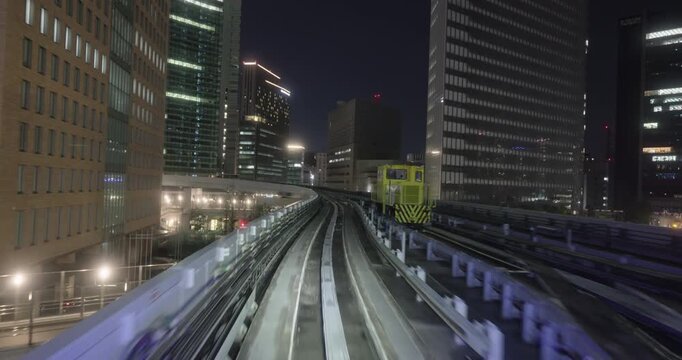 Train goes through city at night,  concept of speed