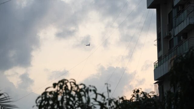An airplane flaying buy a building in Mumbai city 