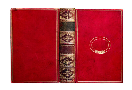 Red morocco leather book binding isolated on white background. Antique hardcover with gilt decoration on spine and cover, vintage bookbinding craftsmanship