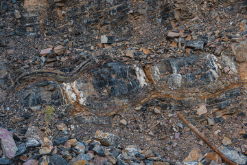Fototapeta premium layers of various limestone rocks visible in the exposed mountainside