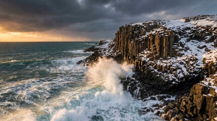 Dramatic winter landscape with basalt columns and crashing waves at sunset on the coast of iceland © Salman