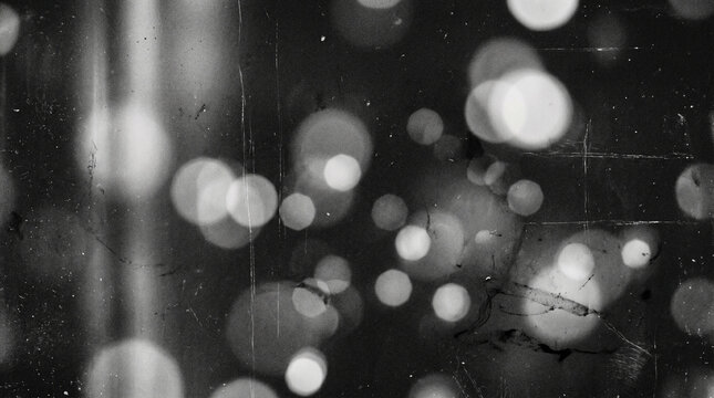 Soft black and white bokeh circles creating a stylish monochrome background.