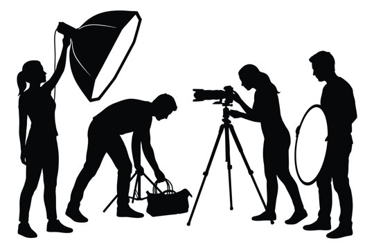 Silhouette of a professional photography crew working in a studio