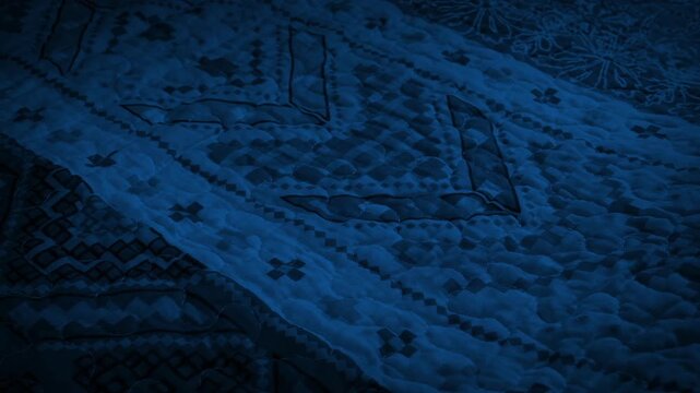 Moving Over Patterned Blanket In The Dark
