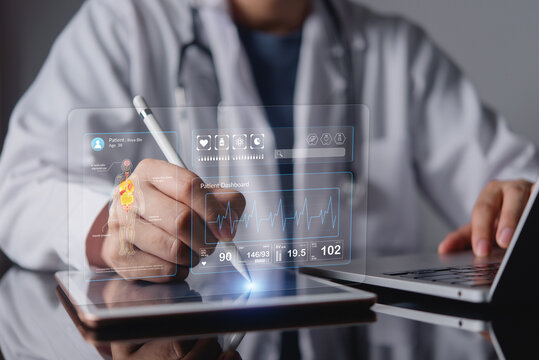 Doctor hands using stylus pen on tablet with futuristic virtual patient dashboard hologram medical data interface electronic health record EHR concept of digital healthcare technology MedTech.