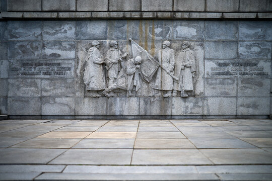 Stone wall relief depicting soldiers in uniform, Slavin Memorial, Bratislava, Slovakia, Europe.