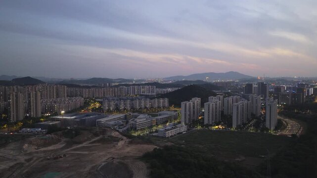 Aerial photography of urban residential areas with numerous high-rise buildings at sunset.