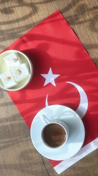 Close-up of traditional Turkish coffee served with delicious Turkish delight lokum on an elegant platter