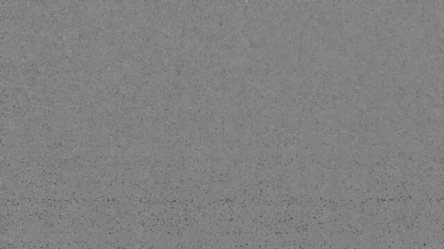 Analog TV Static Noise with VHS Tracking Artifacts and Grainy Pixel Flickering Overlay for Retro Signal Distortion Effect