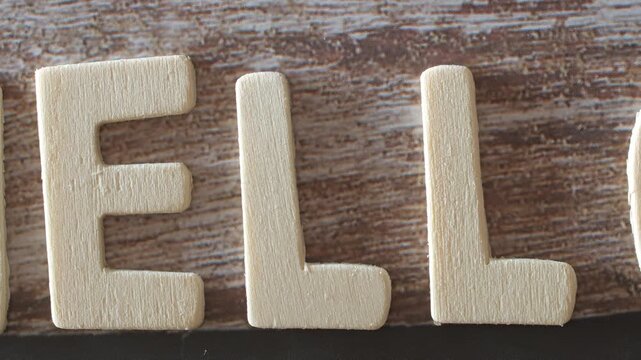 Wooden letters spelling "hello" in English with zoom out