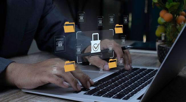 Businessman using laptop for secure login with password authentication. Data encryption system for document management, folder privacy, and cybersecurity.