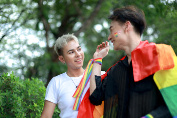 Fototapeta premium Gay couple from the LGBTQ community openly and proudly demonstrated their love and commitment to society by publicly dating on International LGBTQ Day.