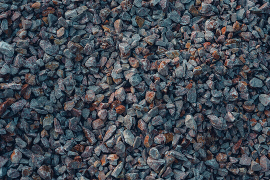 Full frame texture of small grey crushed stones and gravel.