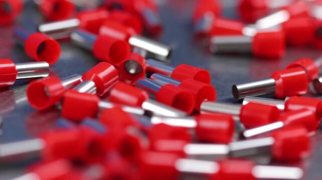 Metal tips with a plastic base for copper electrical wires. 