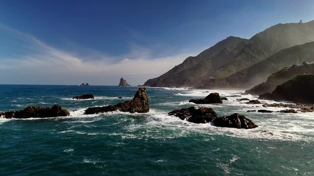 Drone close pass of coastal rocks and waves, Roque de las Bodegas, Tenerife