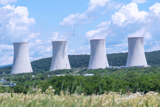 nuclear power plant background blue sky surface close up of cooling towers emitting steam industrial product concept of green energy, atomic station, electricity generation