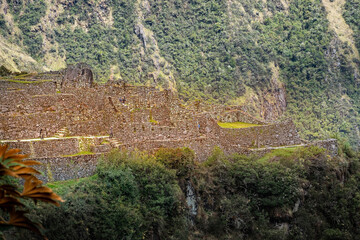 Obraz premium Ancient stone ruins on mountain hillside Andes, Peru - April 30, 2019 LHO Rami